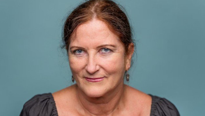 A close-up portrait of Alison Claire France looking straight to camera with an open gaze.